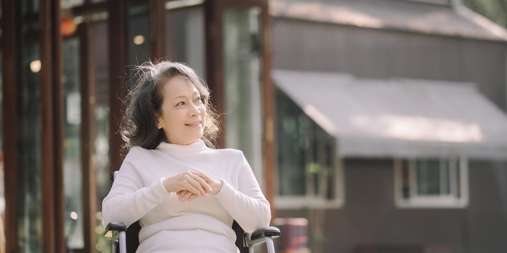 Elderly patient sitting in a wheelchair outdoor